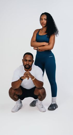 Woman in a dynamic cardio pose against a clean background.